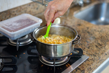Pan cooking brown rice for lunch.