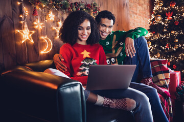 Photo of married people lovers friends prepare for new year event occasion browsing netbook for buying gift ornaments in house indoors