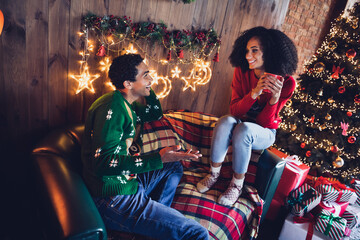 Photo of family lovers friends lady guy enjoy together christmas morning sit couch drink eggnog...