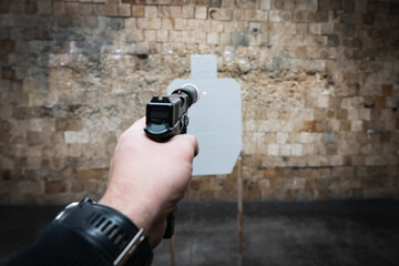 Christmas and shooting at a target with bullet holes in the shape of a sad face at a shooting...