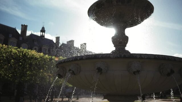 Classical French fountain (Place des Vosges, Paris)
