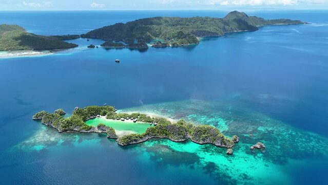 Idyllic Rufas Island, near Penemu in Raja Ampat, is surrounded by healthy corals and open ocean. This island, as well as those in the region, support some of the highest marine biodiversity on Earth.