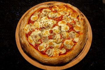 Traditional Brazilian chicken pizza with catupiry cheese and mushrooms