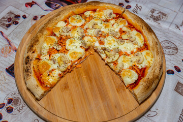 Traditional Brazilian chicken pizza with catupiry cheese and mushrooms