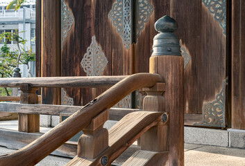 Close up of a wooden handrail in Japan.
Stylized wood work in the entrance to a meditation hall.
