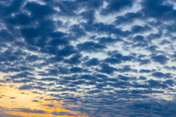 Wonderful idyllic sky with gray clouds and orange tones