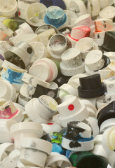A pattern of many used and soiled nozzles from spray cans with aerosol paint. Background texture of...