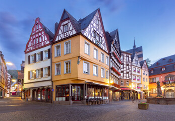 Facades of old traditional houses in the market square at dawn. Cochem. Germany. - obrazy, fototapety, plakaty
