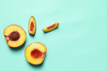 Cut and whole fresh ripe peaches on light blue background, flat lay. Space for text