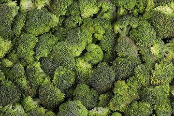 Fresh raw broccoli as background, top view