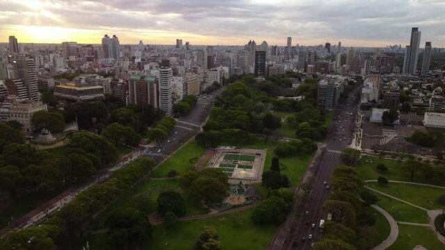 Top view, two parallel highways with different directions, a park between the roads with a sports field, Buenos Aires
