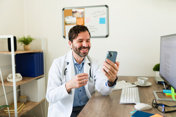 Cheerful virtual doctor on a video call with a patient