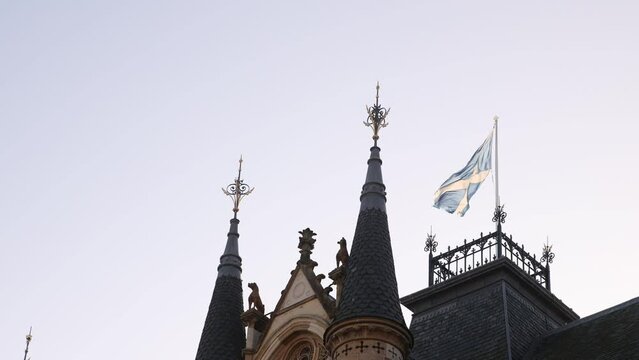 scottish flag waving above the peoples government palace along high street in Inverness, Scotland in the Highlands