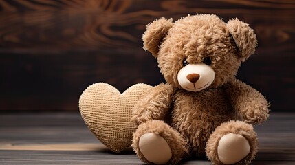 A teddy bear sitting on a floor with a dark and brown