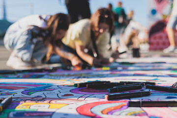 Process of drawing on asphalt and pavement, kids and children with crayons, chalk and markers,...