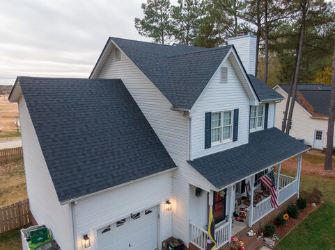 Aerial Drone Image of Newly Installed Asphalt Architectural Style Shingles On A Single Family Home: Architecture, Roofing, Real Estate
