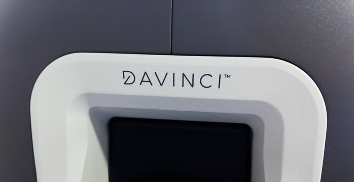 Chicago, IL, USA, November 20, 2023, Da Vinci hospital surgical machine in an operating room, illuminated, with medical staff working, emphasizing precision and modern healthcare