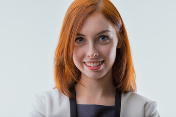 Approachable demeanor, businesswoman with vibrant red hair