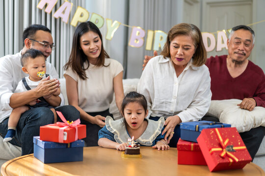 Portrait of happy love asian big family father and mother with asian baby and little girl happy birthday, party, celebration, cake, surprise together.Family party