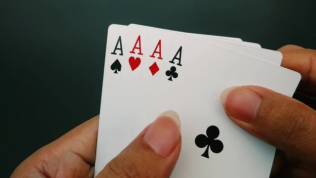 Players hold four aces and then face down the aces or poker playing cards