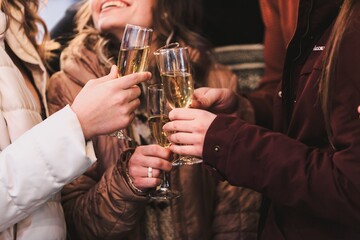 Company drinking champagne at Christmas on the street