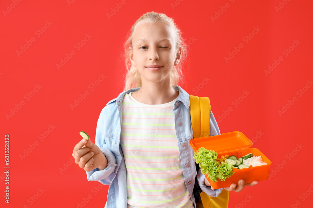 Canvas Prints happy girl with backpack and lunchbox on red background