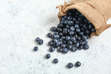 Sack bag with fresh blueberries on white background