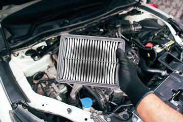 The car air filter is clogged and there are stains on the air filter in the hands of the car...
