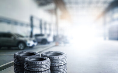 Car tires pile in a car service center or auto tire shop with copy space , Car tire shop and...