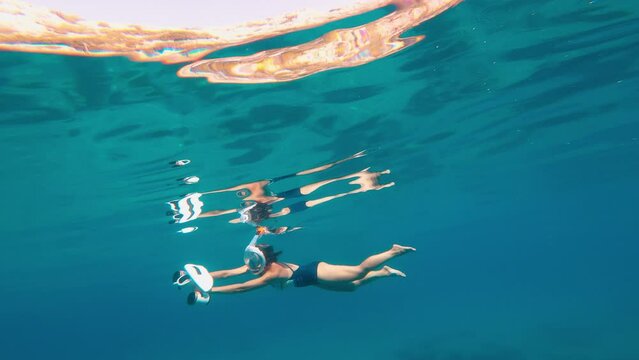 Woman using underwater scooter for diving. Modern sea scooter, modern technology concept.