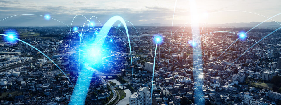 Modern cityscape and communication network concept. Telecommunication. IoT (Internet of Things). 5G. Smart city. Digital transformation.