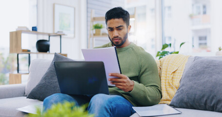 Laptop, documents and man on sofa for finance planning, internet banking and budget at home. Living room, remote work and person with paperwork, report and computer for insurance, website and payment