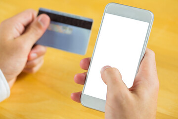 Digital png photo of hand of caucasian man with smartphone and credit card on transparent background