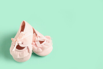 Pink Baby Ballet Slippers on Mint Background © Pixel-Shot
