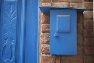 blue color mailbox postbox letter on wall 