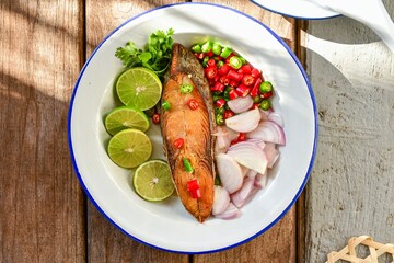 Spicy Deep Fried Salted  Fish, top view food table, close up, thai food