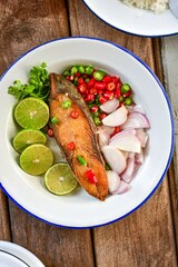 Spicy Deep Fried Salted  Fish, top view food table, close up, thai food