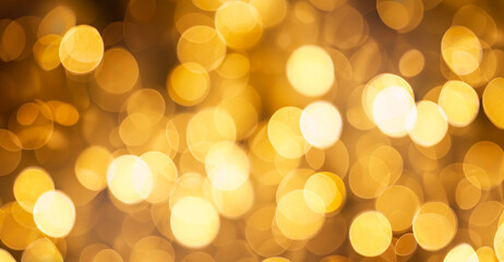 Beautiful Festive Golden abstract Background with bokeh lights. Amazing holiday Golden color...