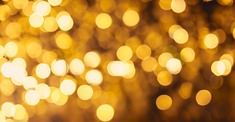 Beautiful Festive Golden abstract Background with bokeh lights. Amazing holiday Golden color...