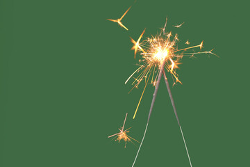 Beautiful Christmas sparklers on green background