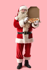 Santa Claus with box of tasty pizza on pink background