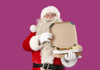 Santa Claus with box of tasty pizza on purple background