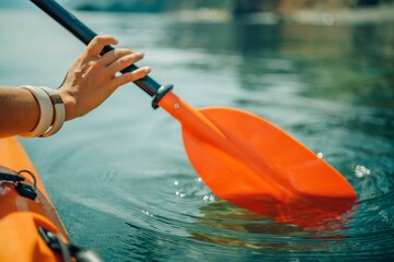 Kayak paddle sea vacation. Person paddles with orange paddle oar on kayak in sea. Leisure active lifestyle recreation activity rest tourism travel