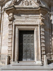 Matera, Italy. View of the main door of a church in Matera. View of the historical part of the town. An Unesco World Heritage Site. Touristic destination