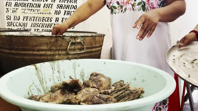 chef kitchen preparation of Yucatan mexico traditional food called "relleno negro"