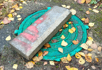 Sewer hatch on the ground in the park