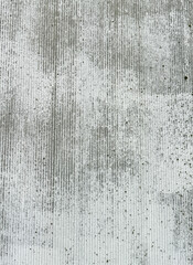 An old wall is painted with white paint as an abstract background. Texture