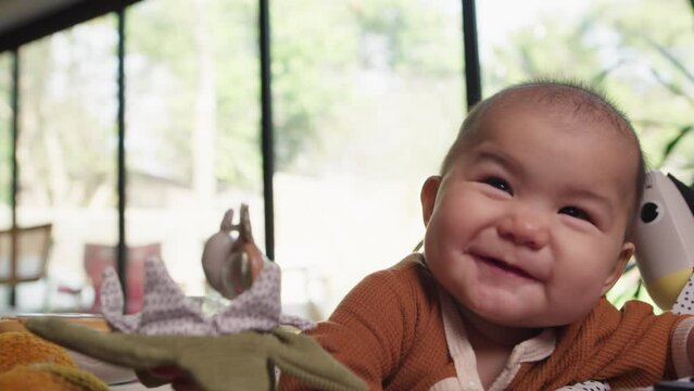Baby being cute and smiling mischievously