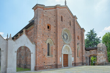 Fototapeta premium Old church with brick facade. Castiglione Olona, Italy with the Collegiate Church of Saints Stefano and Lorenzo from 1425 also called Collegiata