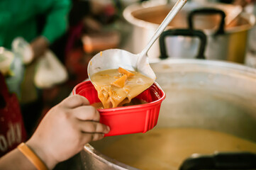 Charity food, Food for the poor hungry volunteers offering food to help the homeless : the idea of getting help from fellow humans